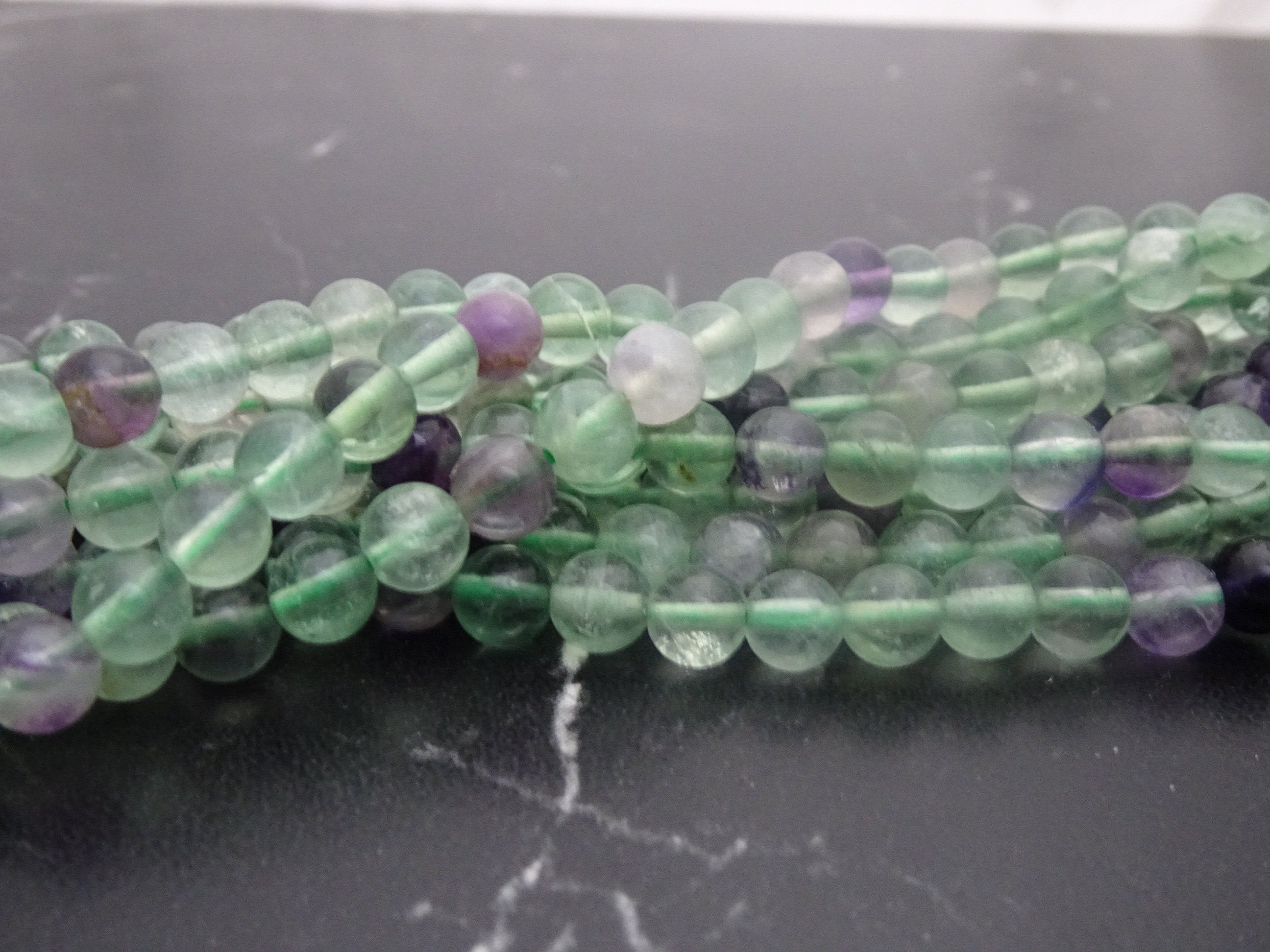 Perles Fluorite 6 et 8mm grade AB+